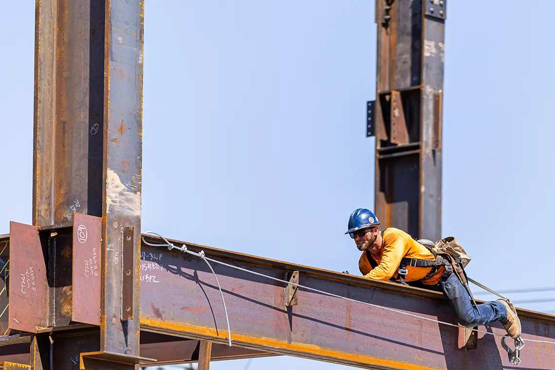 Huff Construction ironworkers erecting structural steel at the JS West Headquarters in Modesto, CA