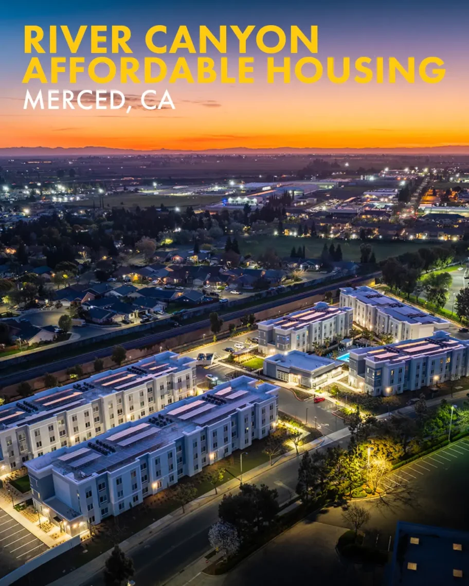 Aerial view of the River Canyon Affordable Housing project in Merced, CA during twilight.