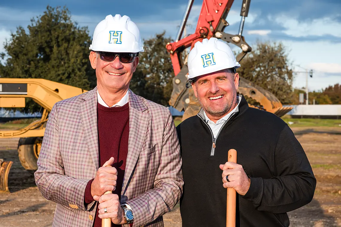 Mike West, CEO of JS West, (left) standing beside Brad Ardis, President of Huff Construction,(right) wearing hard hats and holding shovels during the JS West headquarters groundbreaking in Modesto, CA.