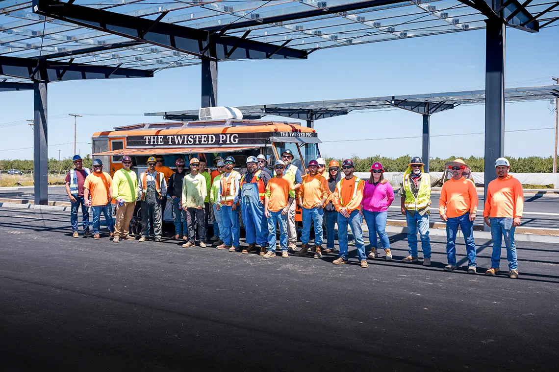 construction crew standing in front of the twisted pig food truck at the JS West headquarters project in Modesto, CA.