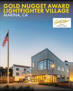 Twilight exterior view of the Lightfighter Village entrance and building sign in Marina, CA
