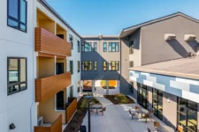 Courtyard walkway connecting buildings at Lightfighter Village